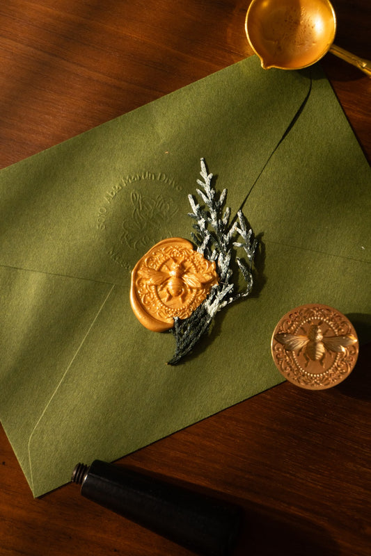 queen bee wax seal and winter invitation